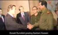 Rumsfeld greets Saddam Hussein